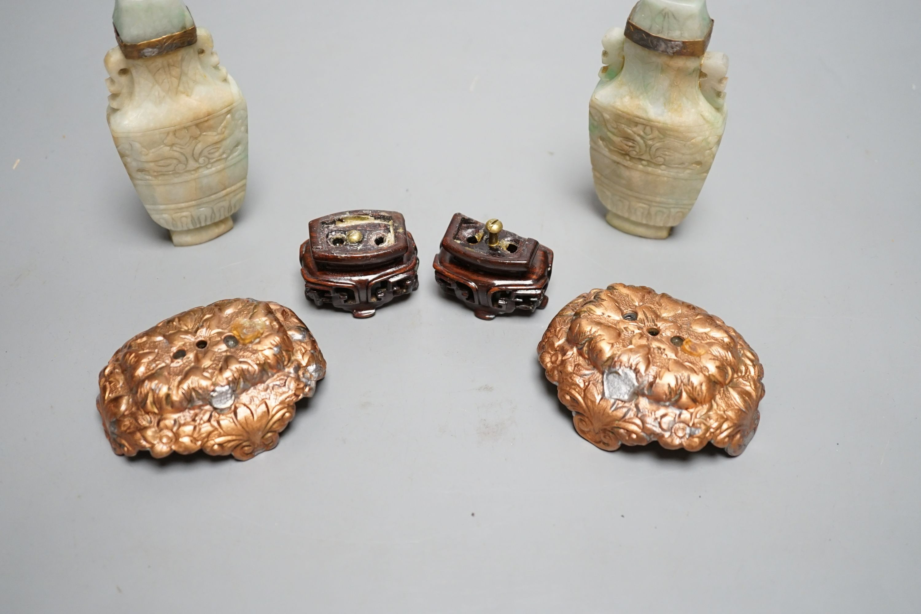 A pair of Chinese jadeite carved vases and covers